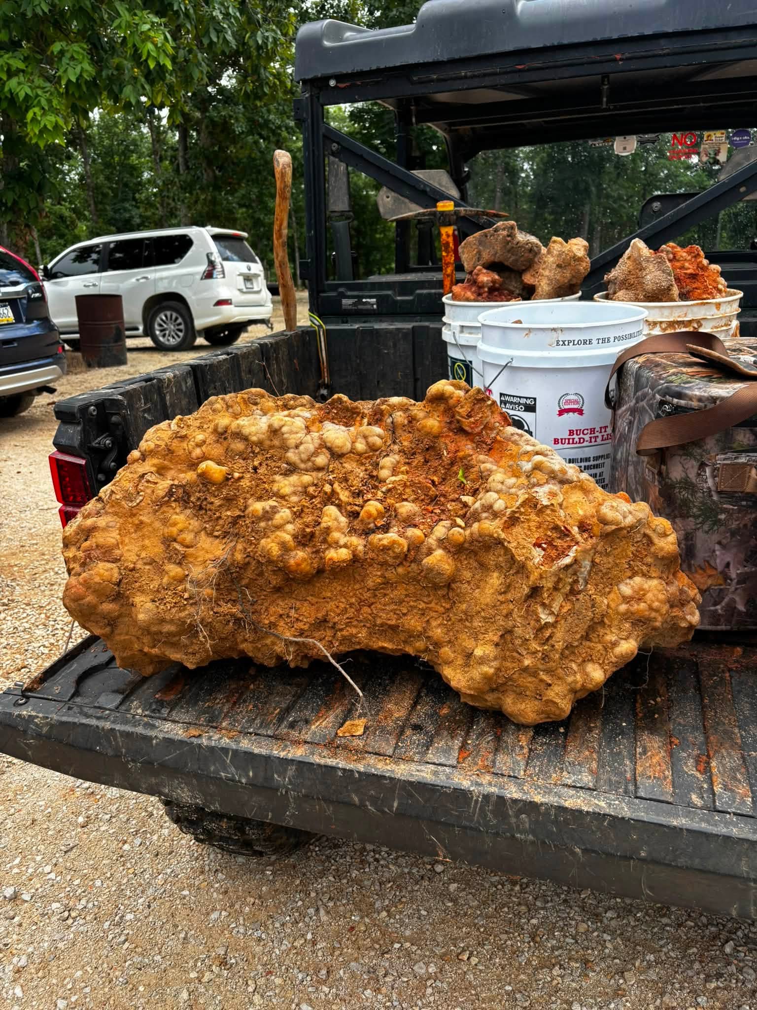 Large orange mineral specimen in a Ranger cargo bed at Haunted Ridge Rocks